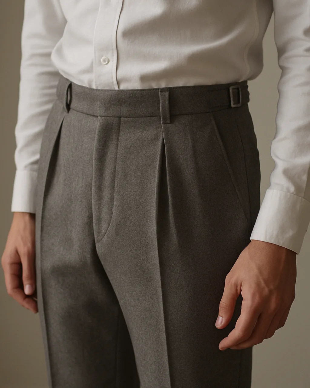 Close-up of single pleated trousers for men showing pleat and waistband